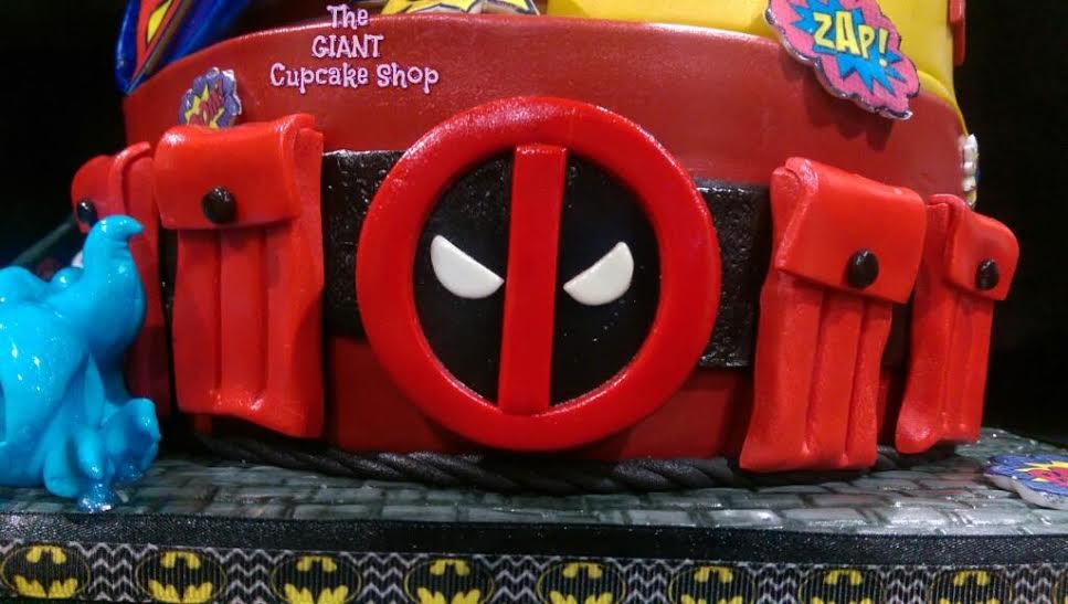 Deadpool's belt cake topper